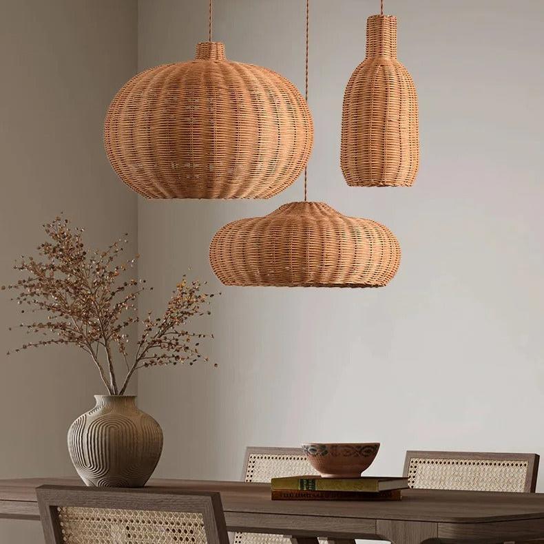 Round and teardrop woven shades above a dining table