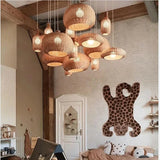 Many woven rattan shades hung together across a wide room