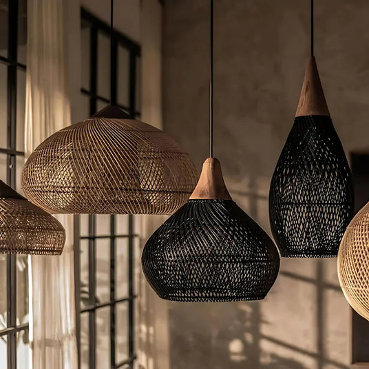 Two woven rattan bells hung over a dining table
