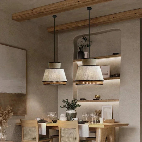 Row of woven rattan pendants above a long dining table