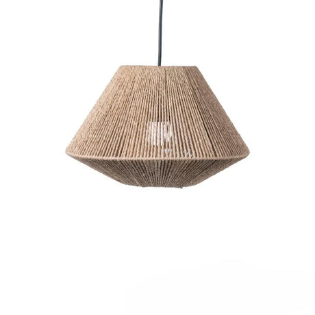 Pleated rattan shade lit warm in a dark interior