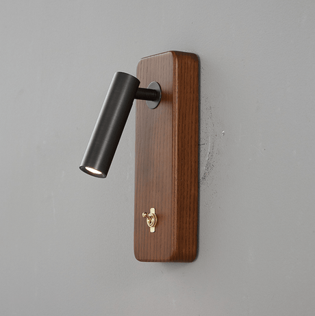 Dark finished reading head on a vertical ash wood plate, angled down