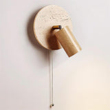 The oak head angled out from the travertine disc with the chain hanging