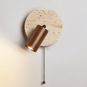 The walnut head lit and angled down from the round travertine plate