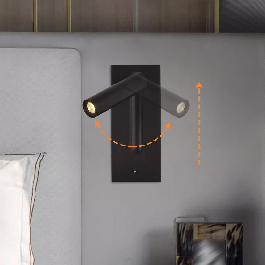 The black reading light beside a headboard, arrows showing how the head turns