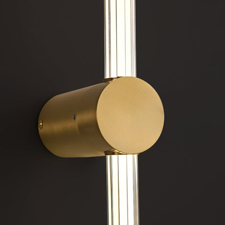 Close view of the copper foot where the frosted tube meets the wall mount