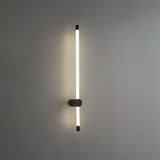 The copper version lit on a gray wall, the tube standing clear of the mount