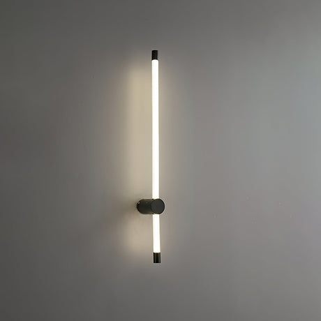 The copper version lit on a gray wall, the tube standing clear of the mount