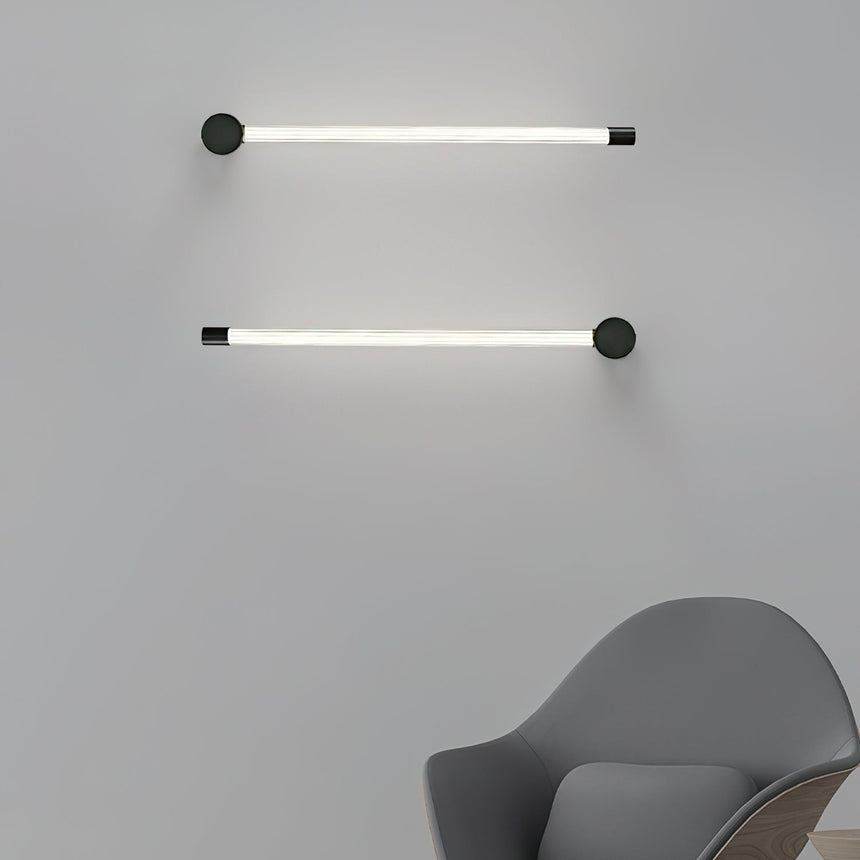 Two tubes mounted horizontally one above the other beside a gray armchair