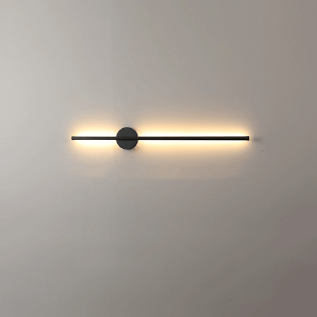 The lit bar seen straight on, a soft gradient washing the wall behind it