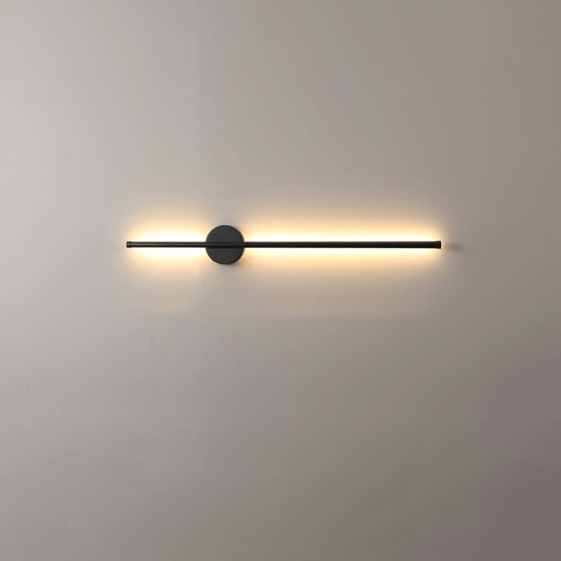 The lit bar seen straight on, a soft gradient washing the wall behind it