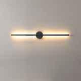The bar lit warm on a pale wall, the glow spreading evenly to both ends