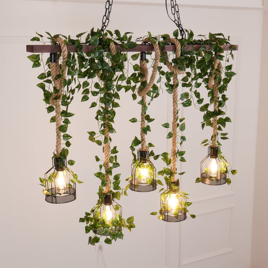 The eight cage version lit in a white room, trailing foliage hanging from the timber beam