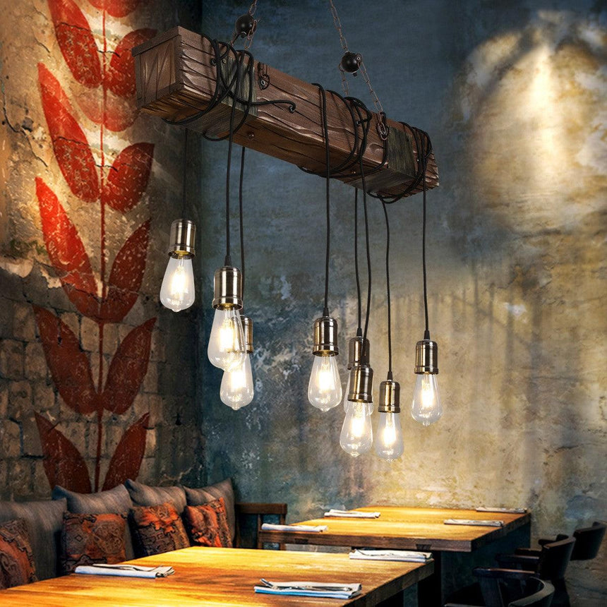 The beam lit in front of a dark painted mural wall above seating