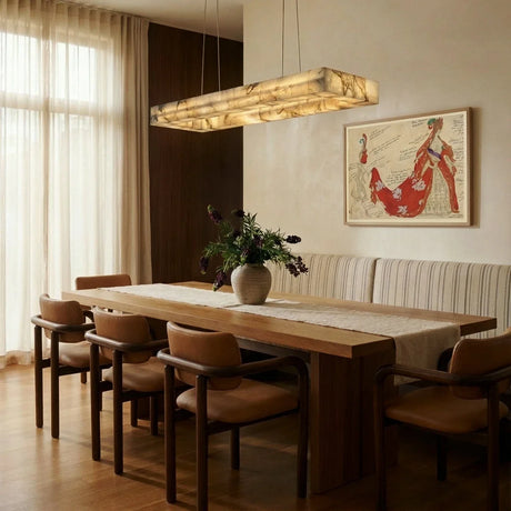 A lit stone bar above a timber dining table with a banquette