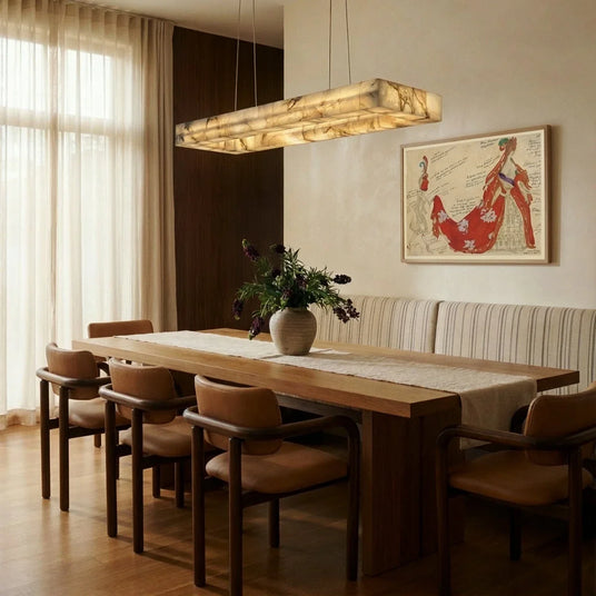 A lit stone bar above a timber dining table with a banquette