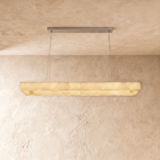 A lit alabaster bar seen from below against a plaster ceiling