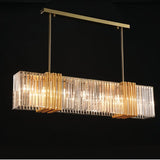The long gold bar lit on a dark ground, the ribbed shades glowing in a row