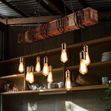 Hung above open shelves holding teapots and bowls in a warm timber room