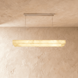 A lit stone bar seen at a slight angle below its ceiling plate