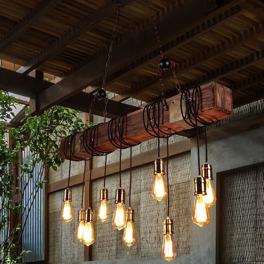 The beam lit under a verandah roof with plants and a timber wall behind