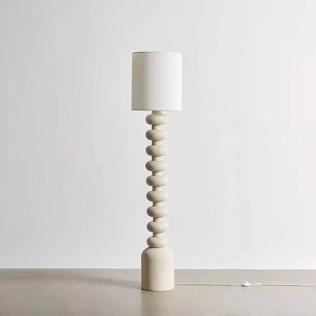 Resin and fabric pendant lamp with warm white LED glow