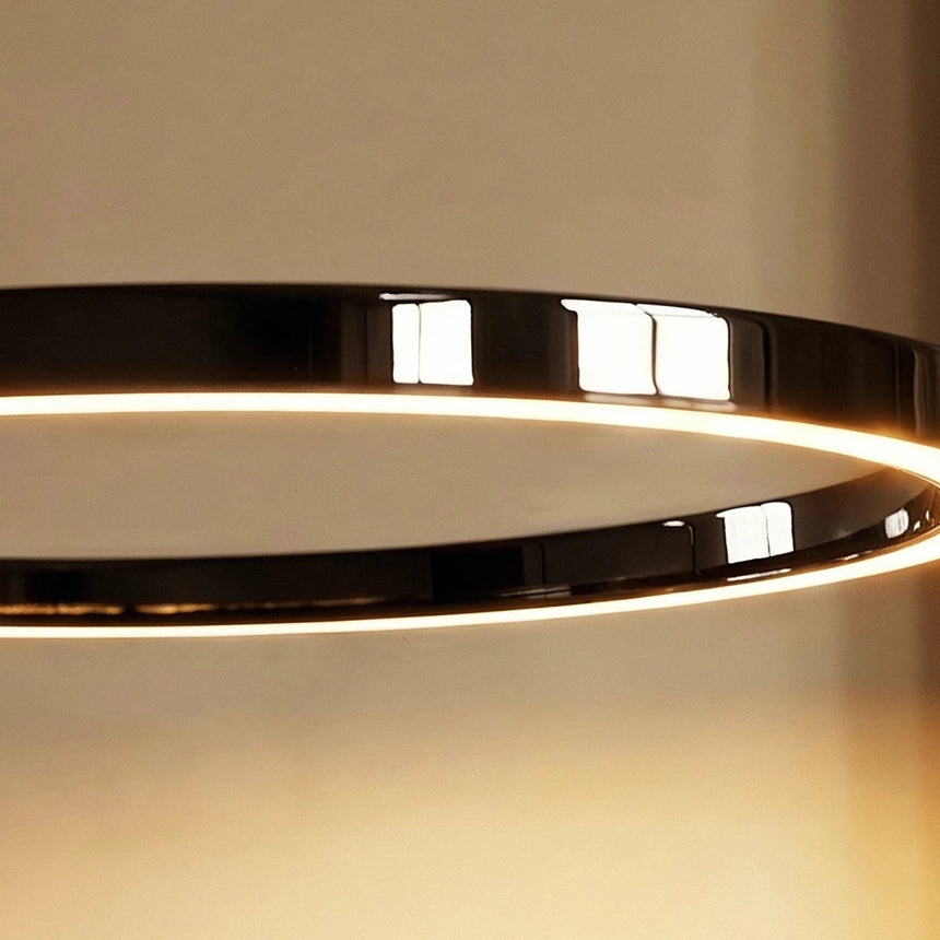 The black ring seen from the side, a continuous line of light along its inner face