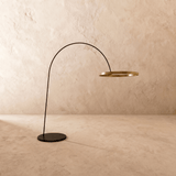 The gold ring and curved arm at an angle, the flat round base on the floor