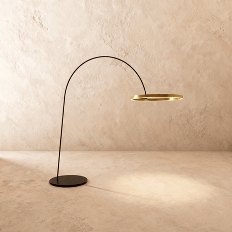 A thin black arm curving from a flat disc base to a lit gold ring at its end
