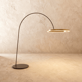 The taller version of the lamp, a wider gold ring held further out on the arm