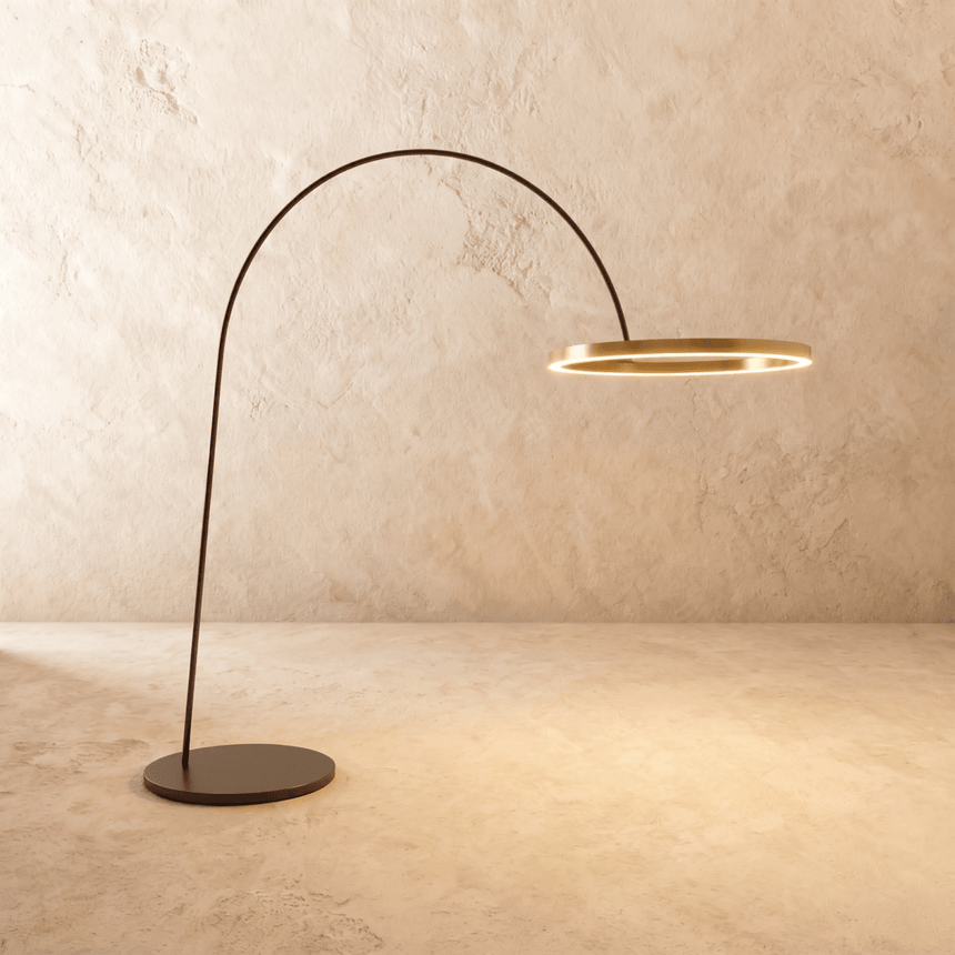 The taller version of the lamp, a wider gold ring held further out on the arm