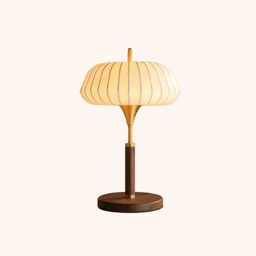 Remote control table lamp seen from the front against a pale ground