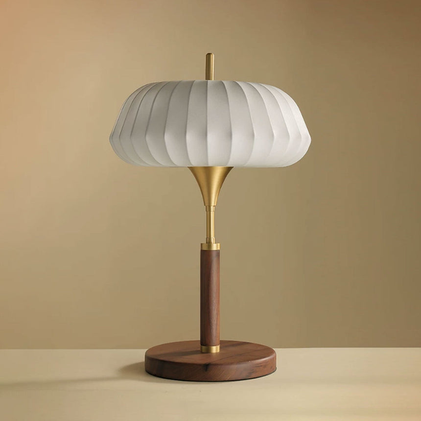 Remote control table lamp unlit against a plain warm ground