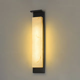 The panel lit on a plain wall, the warm light spreading up and down