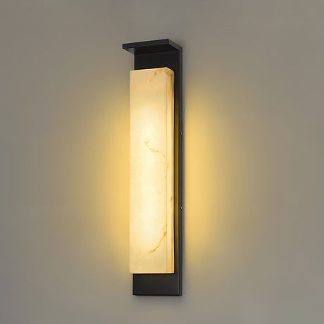 The panel lit on a plain wall, the warm light spreading up and down