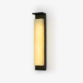 Tall outdoor wall sconce with a black frame and a veined white resin panel, lit warm