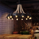 The horns lit in a brick walled room above wood tables and benches