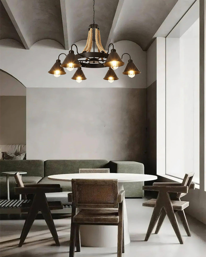 The horns lit above a dining table in a plain plaster room