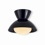 Black gourd ceiling light shown at an angle on a plain backdrop