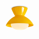 Yellow gourd ceiling light shown at an angle on a plain backdrop