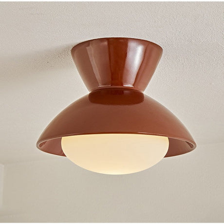 Close view of the terracotta red gourd ceiling light and its opal glass dome