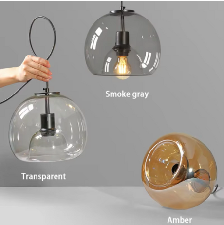The three glass tints shown together with a hand holding one by the cord