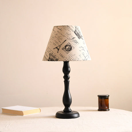Table lamp with a birch print shade on a turned black base