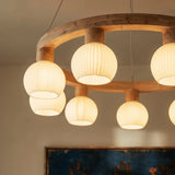 The wood ring seen from below with the ribbed globes hanging inside it