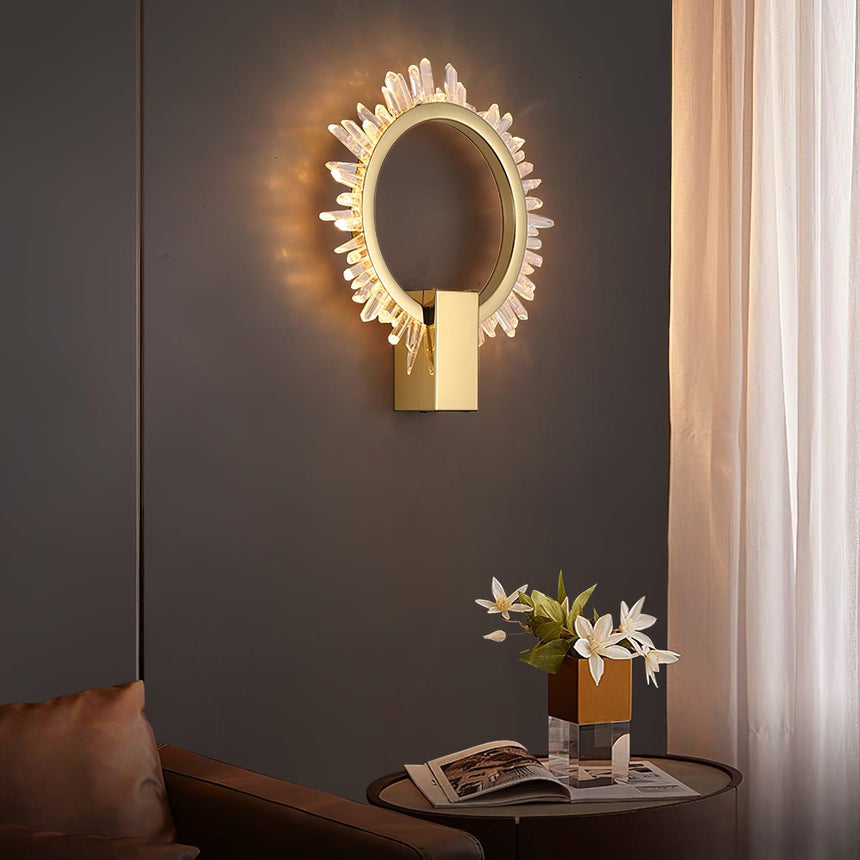 The ring above a round side table with a book and flowers beside a sheer curtain