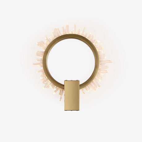 Gold ring wall light fringed with clear crystal points, lit from within
