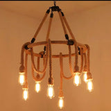 The rope crown build lit warm, six lamps ringed under the swags