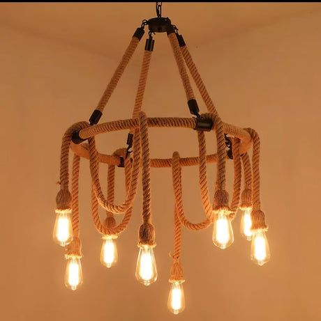 The rope crown build lit warm, six lamps ringed under the swags