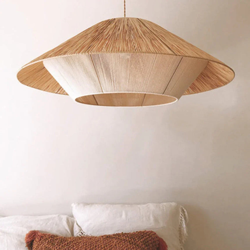 Hemp rope shade hung in front of a plaster wall