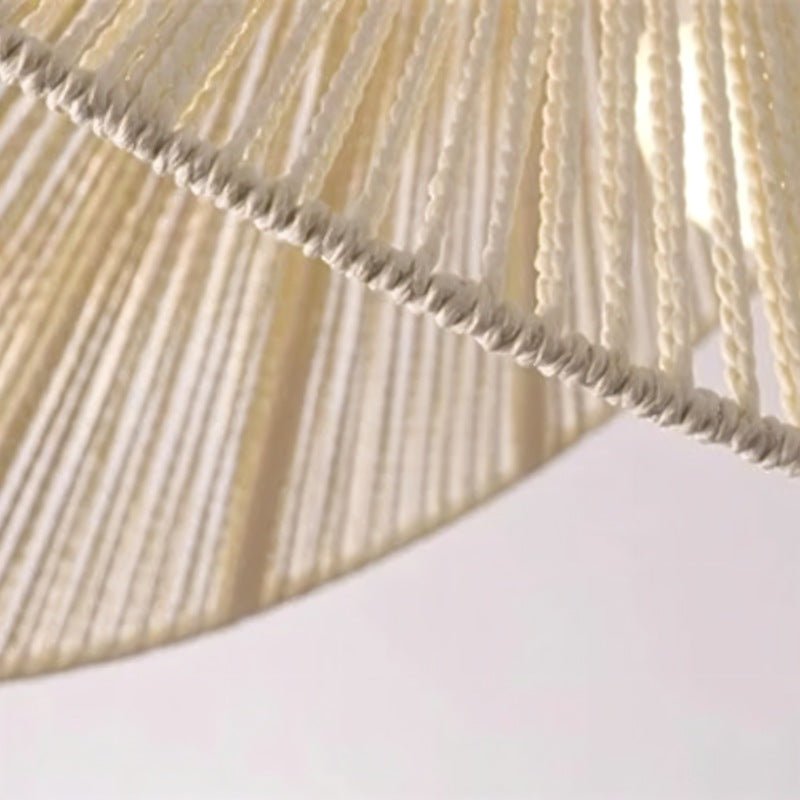 The twisted rope worked in a fine spiral, seen close at the edge of the shade